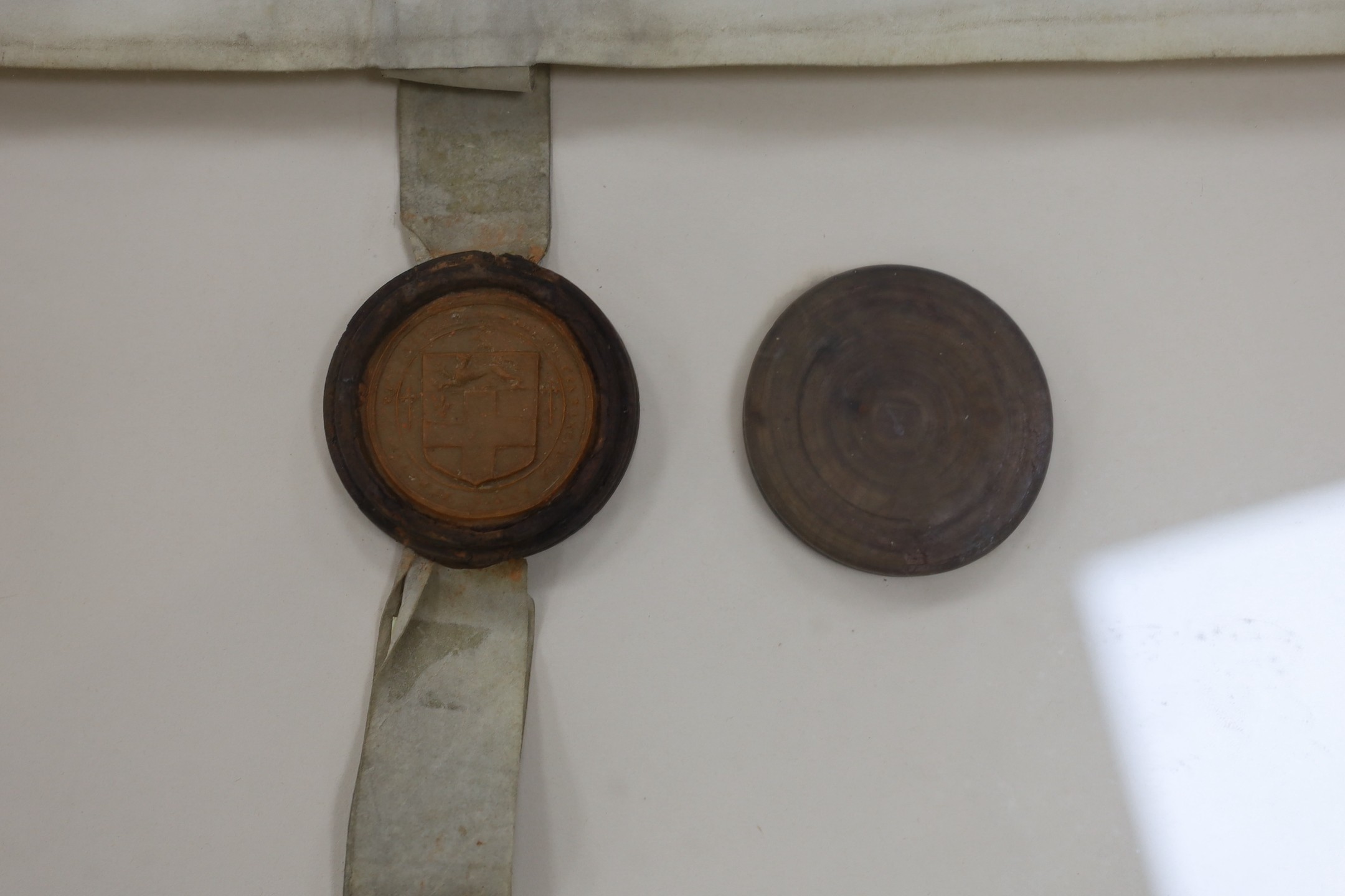 Two documents relating to a grant of arms to Edward Sebright of Blakeshall in Wolverley, Worcestershire, gentleman, April 1580